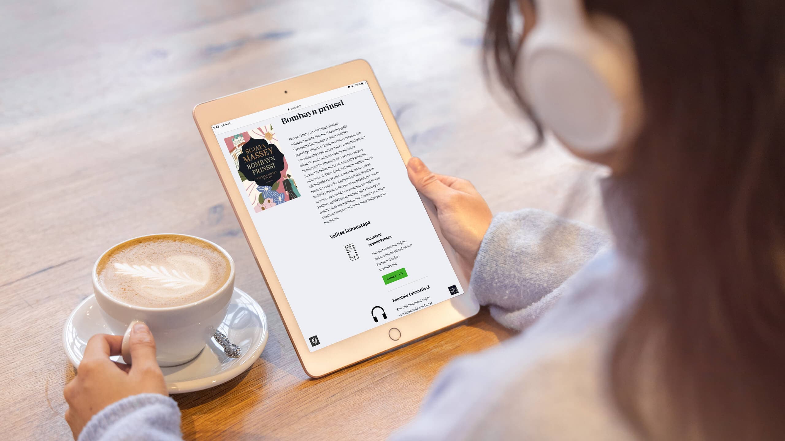 Pitkähiuksinen käyttäjä selailee Celianetiä tabletilla